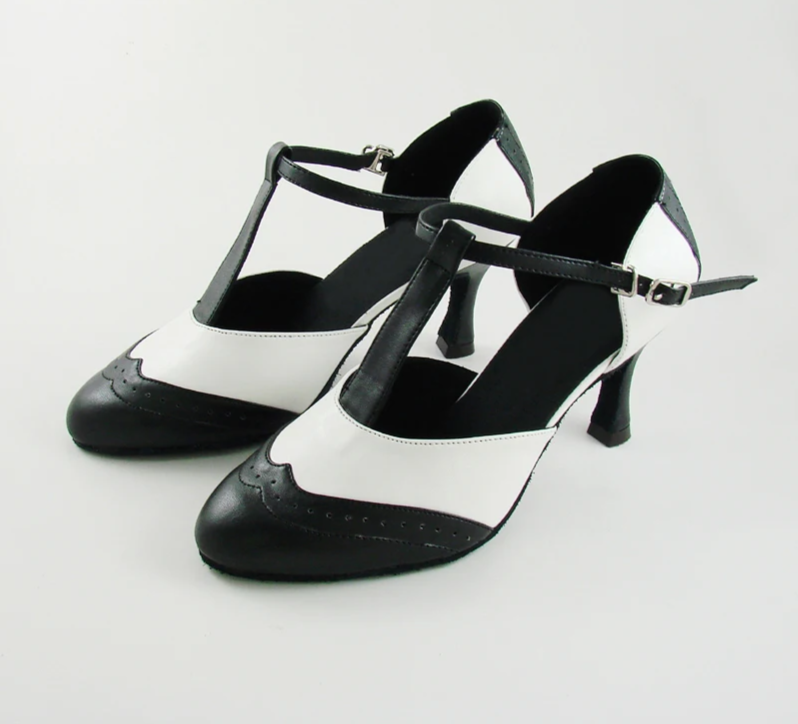 Black and white T-strap dance heels with a buckle closure