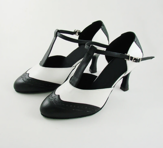 Black and white T-strap dance heels with a buckle closure