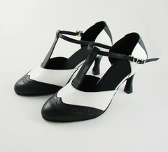 Black and white T-strap dance heels with a buckle closure