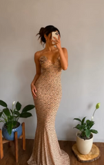 Polka dot floral print maxi dress with spaghetti straps and floral embellishment.