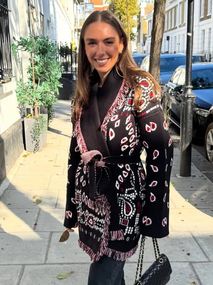 Woman wearing a patterned scarf on a city street