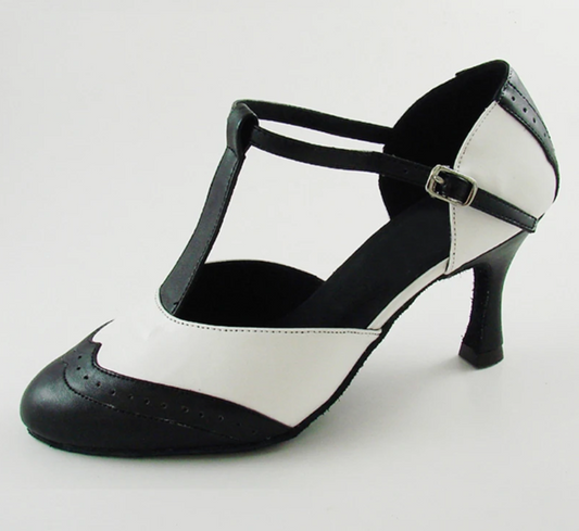 Close-up of a black and white T-strap dance heel