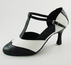 Close-up of a black and white T-strap dance heel