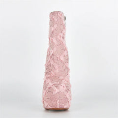Pink lace-patterned bottle on a white background