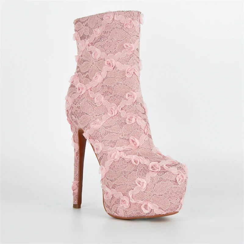 Pink lace boot with a high heel on a white background