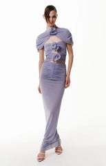 A model wearing a glamorous violet floral cutout maxi dress, perfect for evening events. Golden Atelier 2