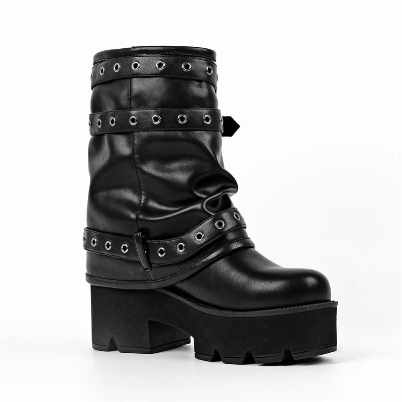 Side view of black faux leather platform ankle boots with buckle straps.