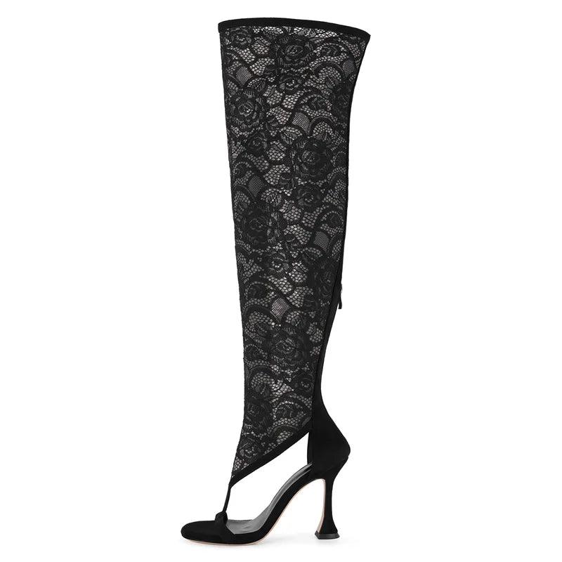 Black lace over the knee stiletto boots with a pointed toe.