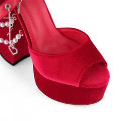 Red high-heeled shoe with open toe on a white background