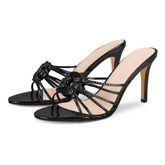 Black patent leather stiletto heel sandals with a knotted strap detail
