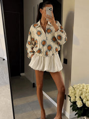 Sunflower print bomber jacket worn by model outdoors
