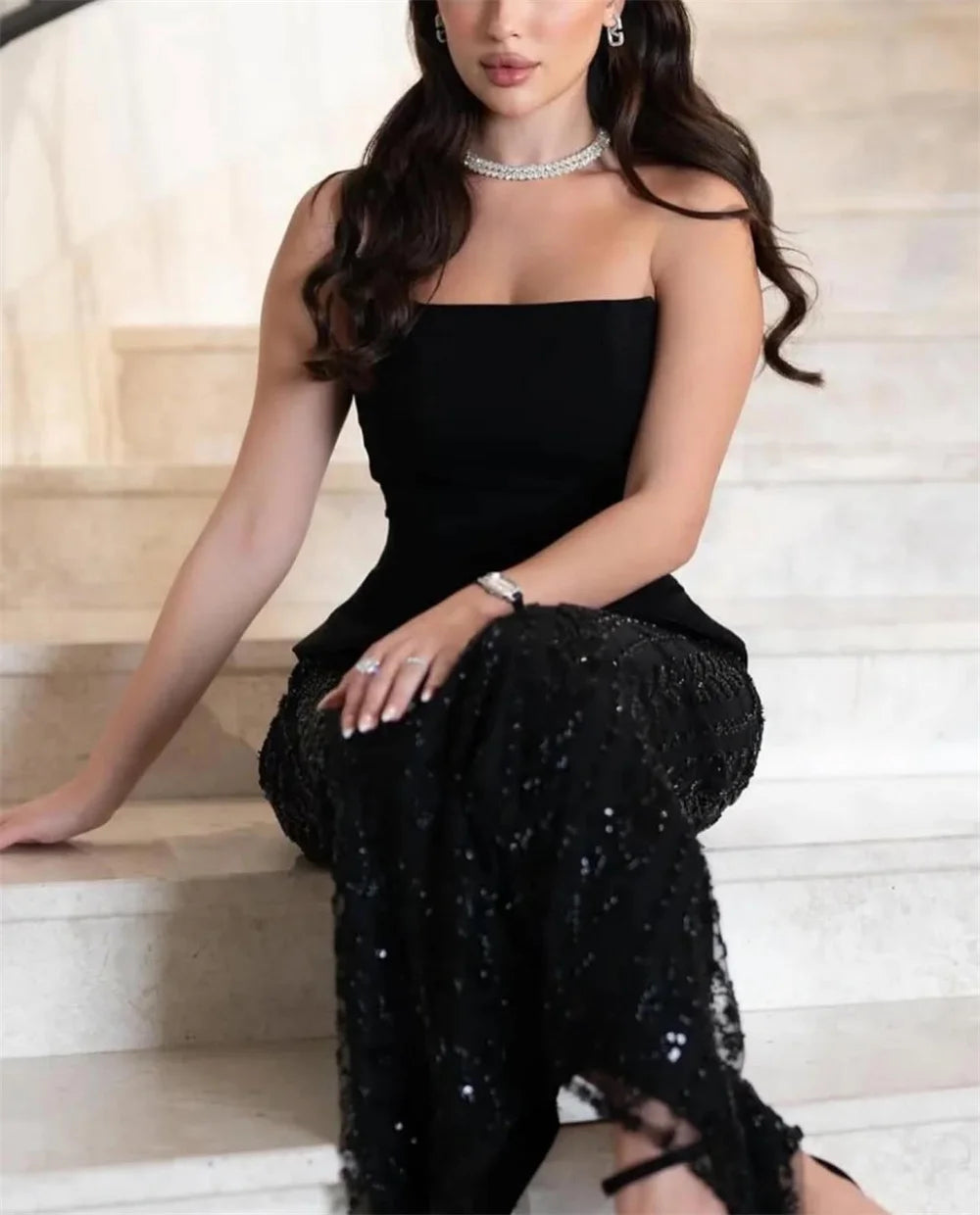 Black strapless sequin A-line prom gown with shawl.

