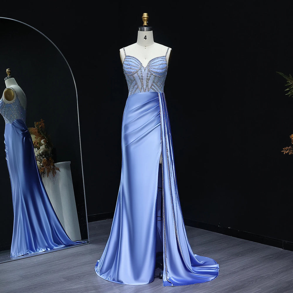 Blue evening gown on a mannequin against a dark background