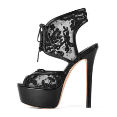 Black lace high-heeled shoe on a white background