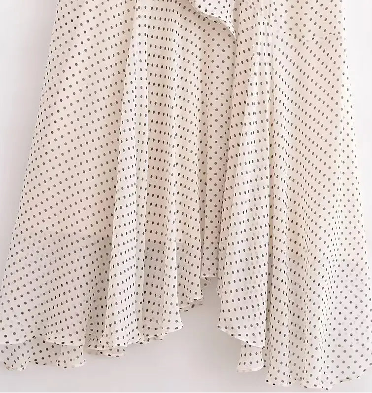 Polka dot fabric swatch on a light background