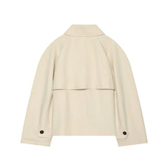 Asymmetric lapel single button jacket collar detail