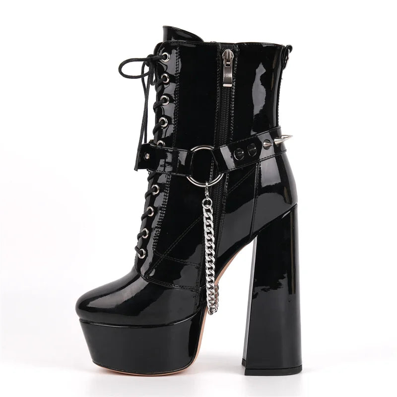 Close-up of black patent leather platform lace-up chunky heel boots