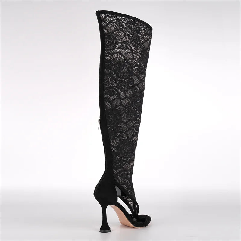 Side view of black lace over the knee stiletto boots.