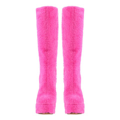 Front view of pink fluffy platform knee-high boots