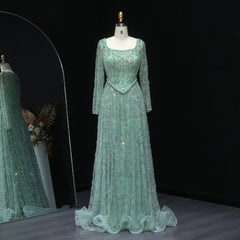Green beaded evening gown on a mannequin against a black background