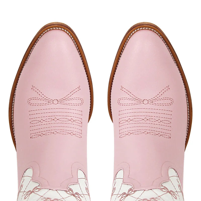 Close-up of the pointed toe on pink bow quilted knee-high boots