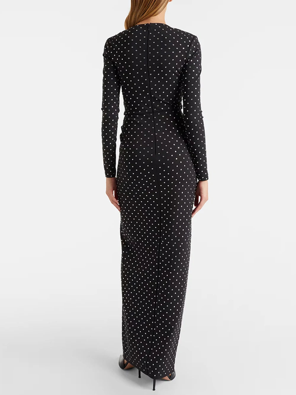 Black dress with white polka dots on a white background