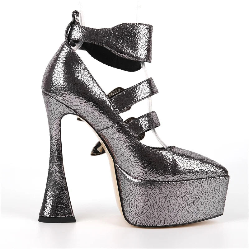 Silver high-heeled platform shoe on a white background