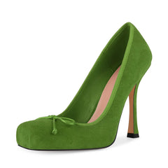 Green high-heeled shoe on a white background