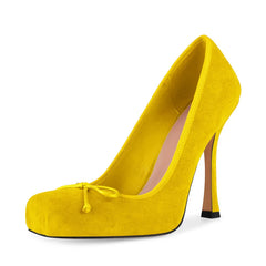 Yellow high-heeled shoe on a white background