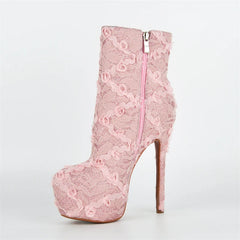 Pink lace boot with a high heel on a white background