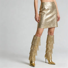 Full leg view of metallic fringe over the knee boots