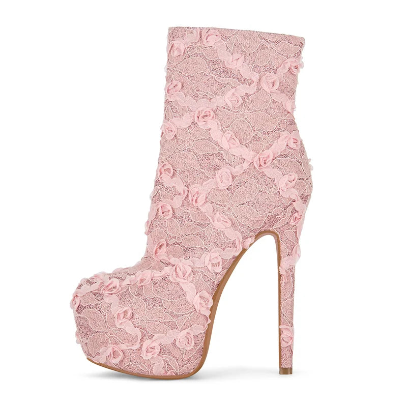 Pink lace boot with a high heel on a white background