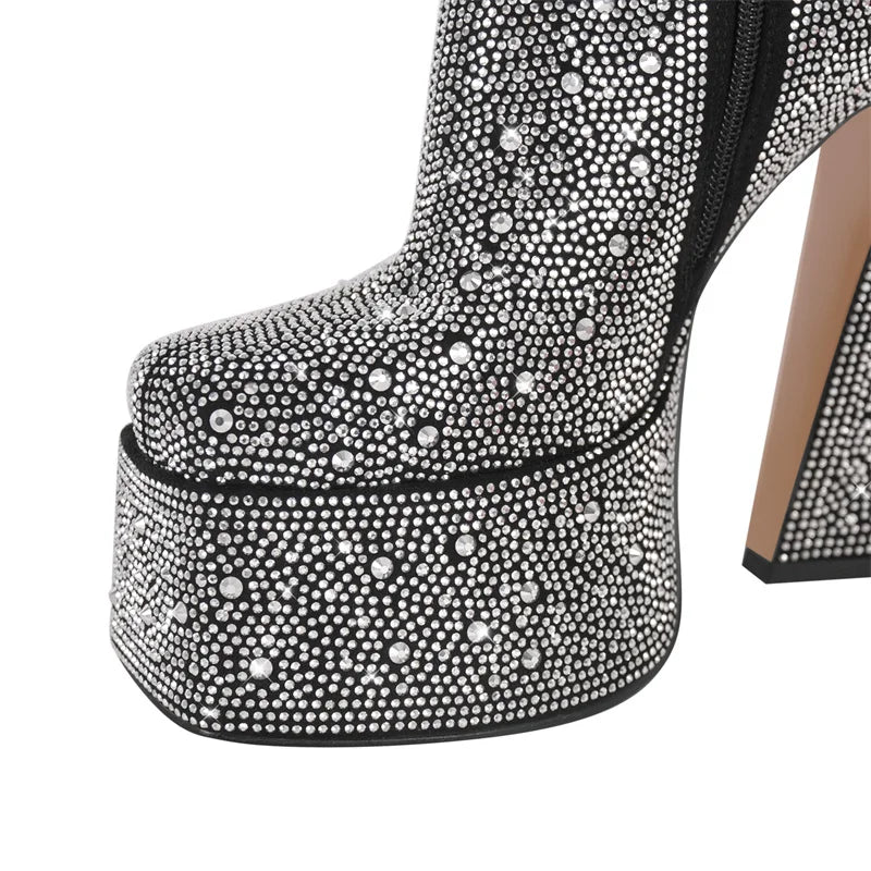Close-up of platform detail on black rhinestone chunky ankle boots