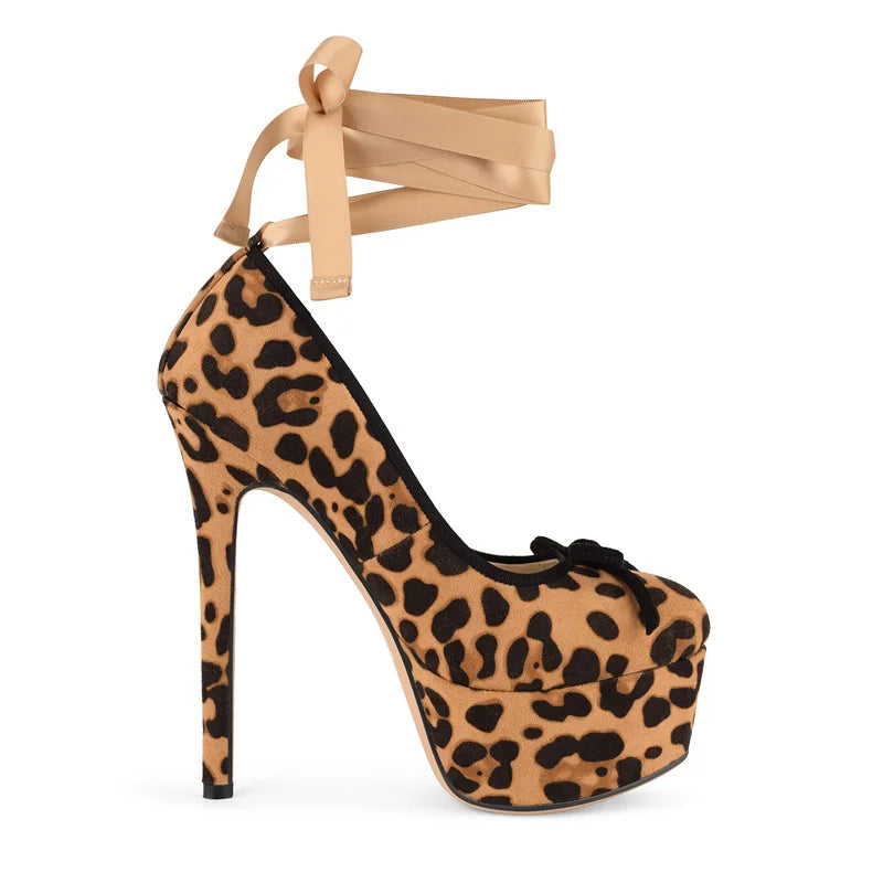 Leopard print high-heeled shoe with beige ribbon on a white background