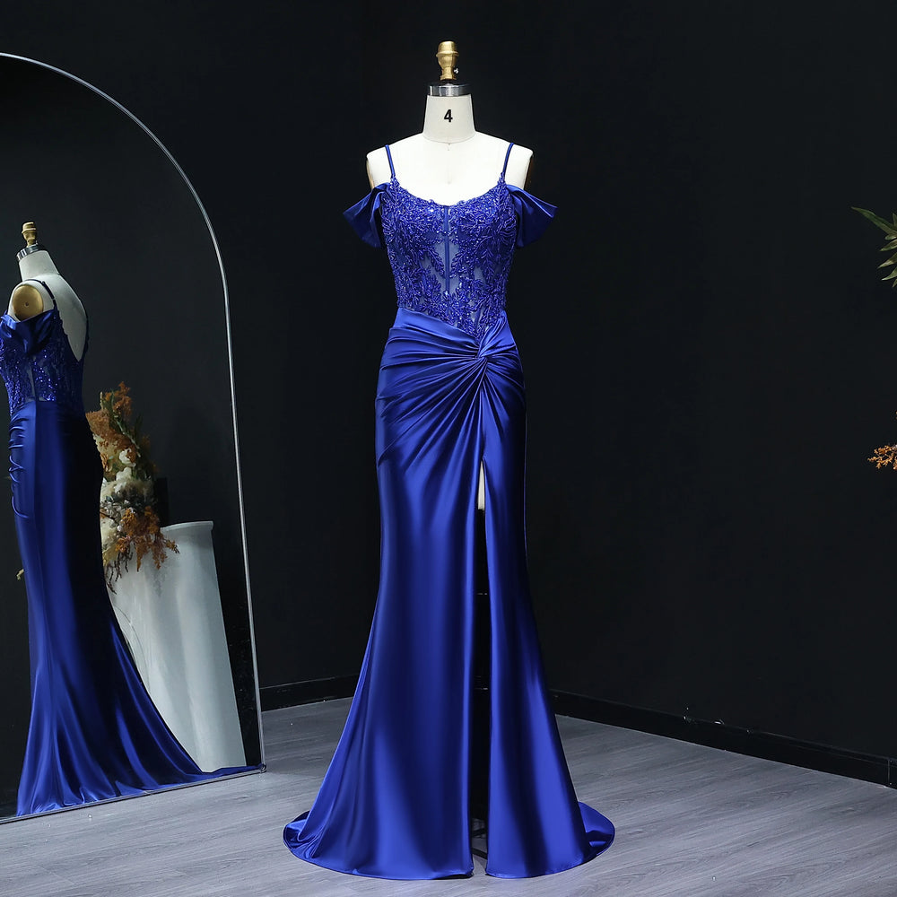 Blue evening gown on a mannequin against a black background