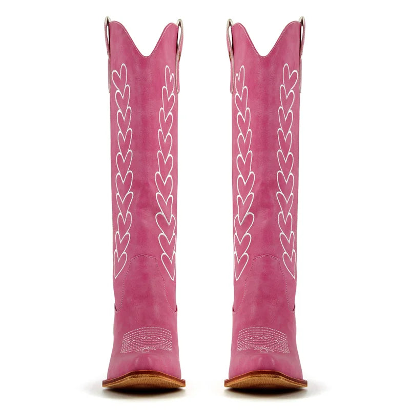 Pink western boots with white heart embroidery detail and pointed toe