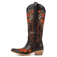 Black cowboy boot with red floral embroidery on a white background