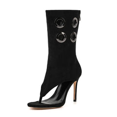 Black cut-out stiletto heel boots with metal rings
