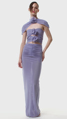 A model wearing a glamorous violet floral cutout maxi dress, perfect for evening events. Golden Atelier 1