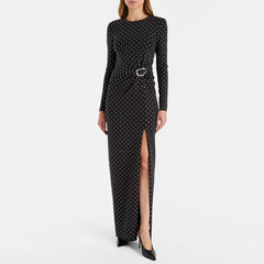 Black dress with white polka dots and a belt on a white background