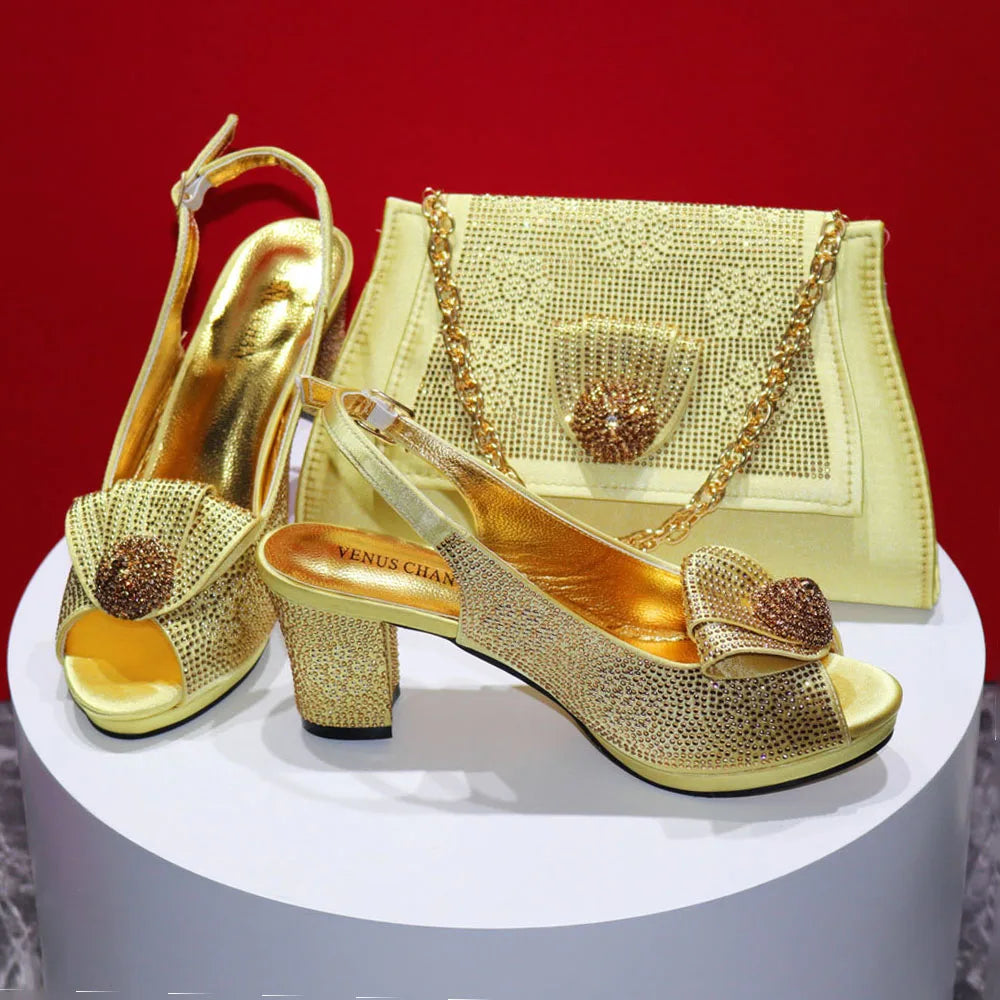Gold high-heeled shoes with decorative bow and matching handbag on a red background