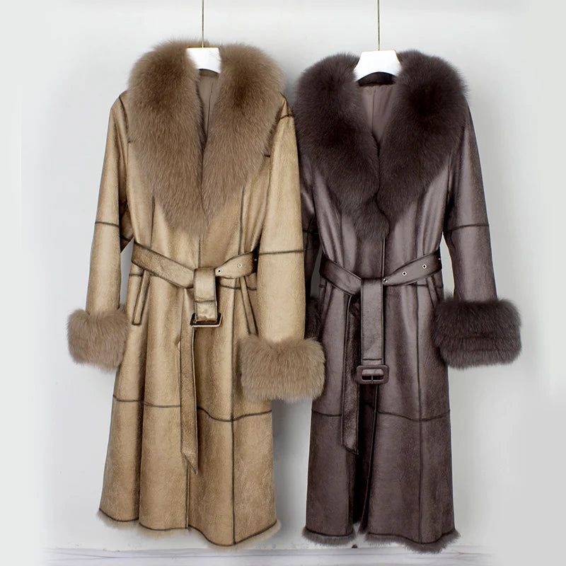 Two fur-coated coats with fur collars and cuffs on hangers against a white background.
