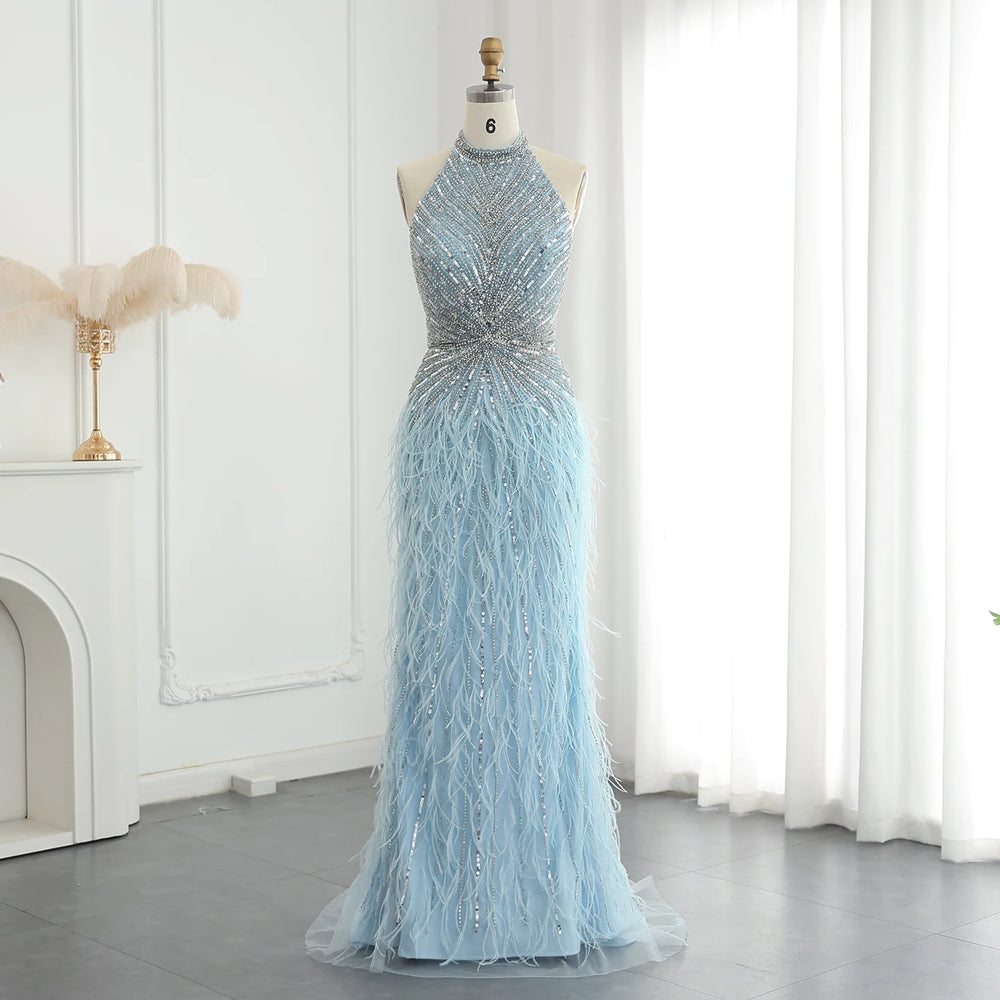 Light blue evening gown on a mannequin against a white curtain background