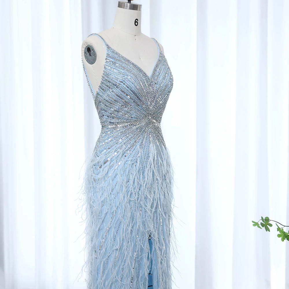 Silver beaded evening gown on a mannequin against a white background