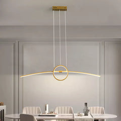 Golden Atelier LED pendant lamp with a modern design, hanging from a ceiling and casting a warm glow. Text overlay indicates voice control compatibility with Alexa. 1