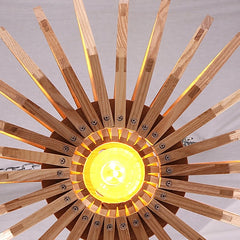 Close-up of the chandelier, showcasing the natural wood grain and minimalist design. Golden Atelier 3