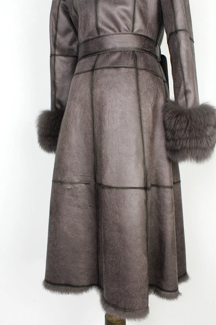 Long coat with fur cuffs on a white background