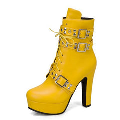 Close-up of lace-up platform ankle boots with buckle detail. Yellow 4