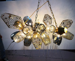 Decorative chandelier with geometric design on a white background