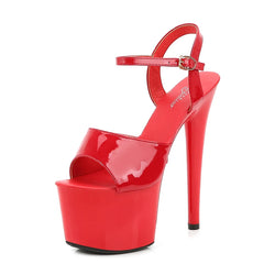 Red high-heeled platform shoe on a white background